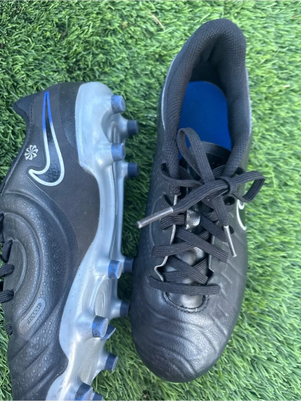 Nike Kids Black Soccer Cleats with Blue Accents